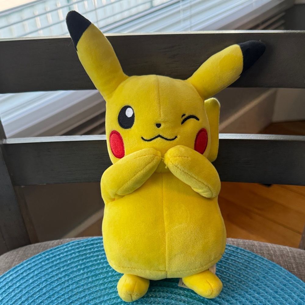 Pokémon Pikachu Plush winking hands together